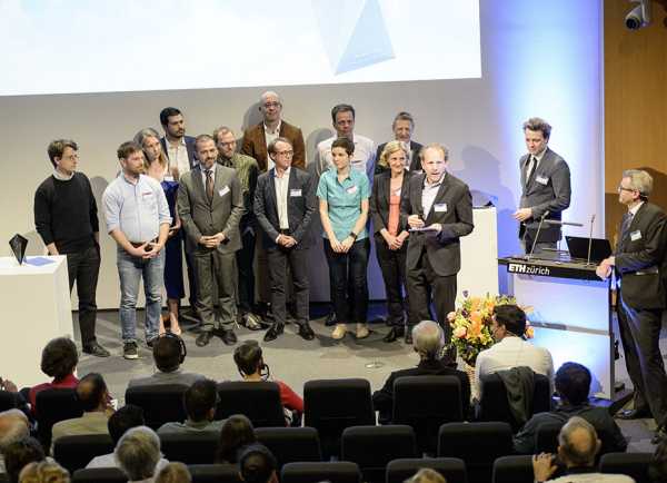 ETH professor Mirko Meboldt (right of the group) presents the nominees with a M?bius strip.