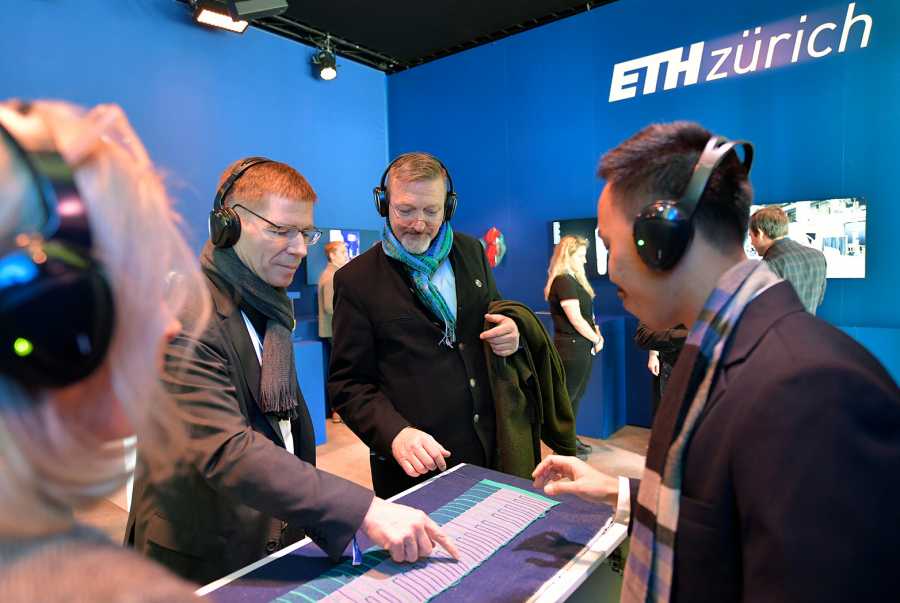 ETH Zurich President Jo?l Mesot is testing the textile piano keyboard.