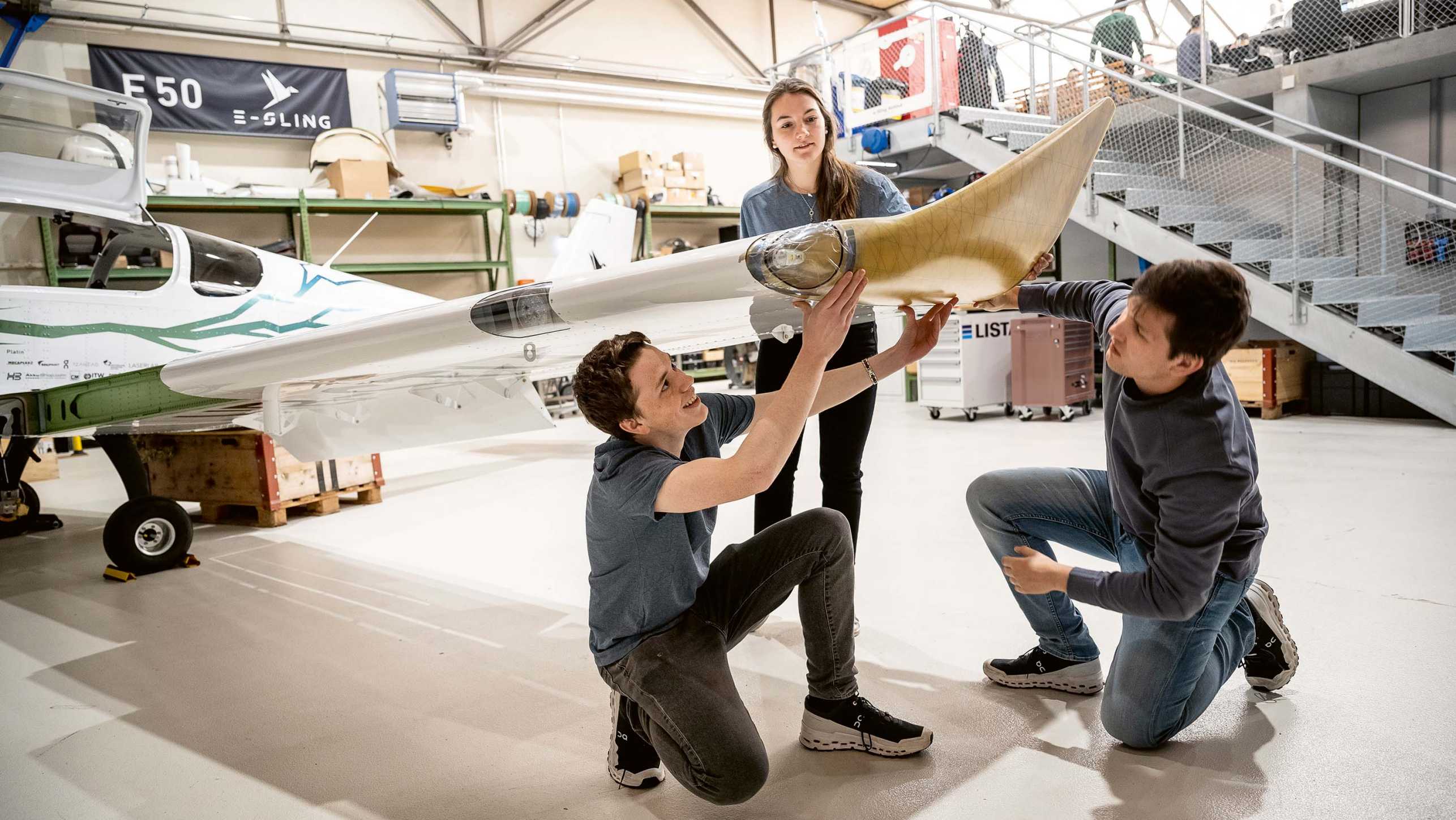 Jan, Elsa and Joël examine the wing tip